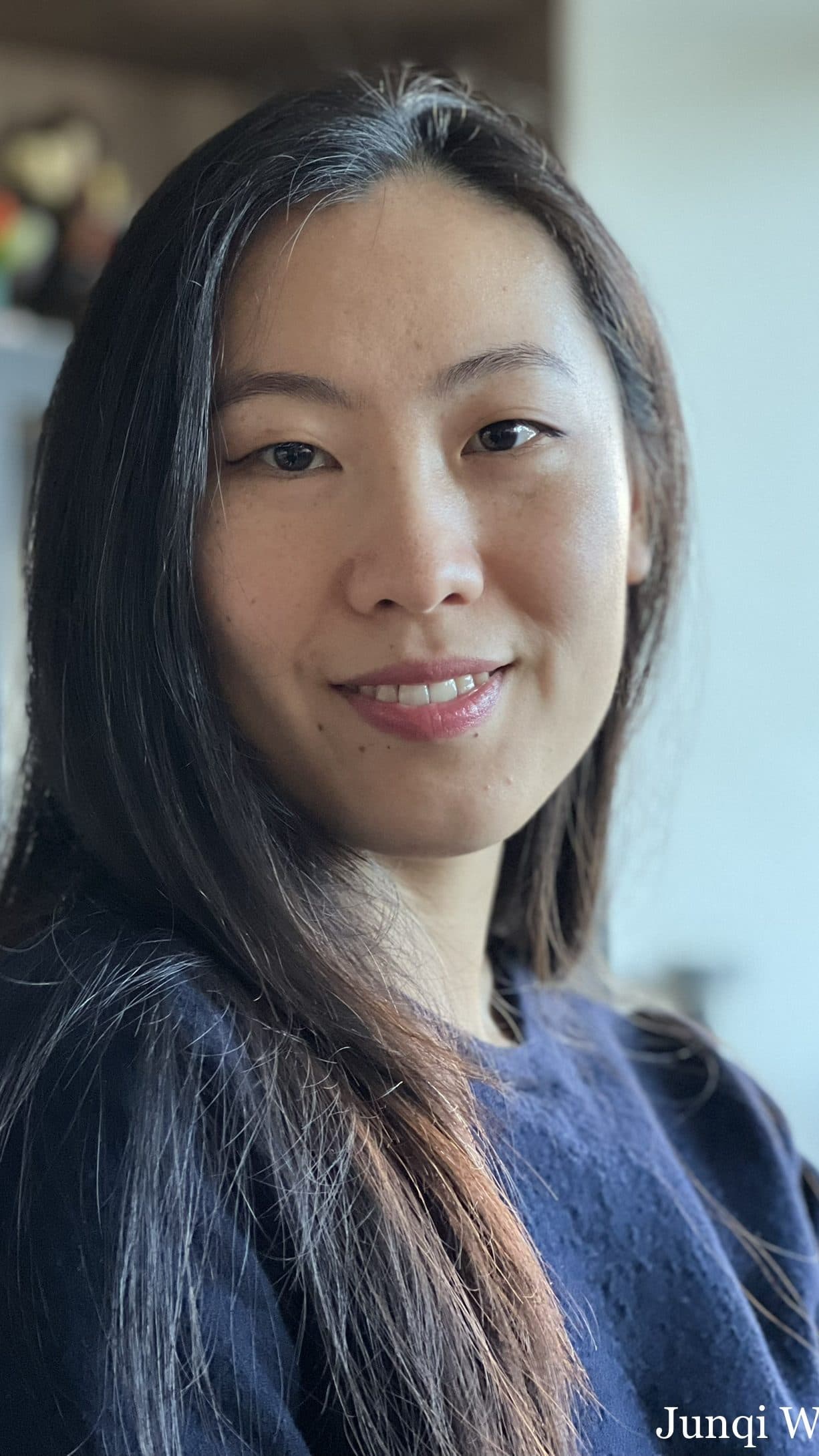 Portret van Junqi Wang